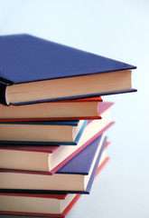 Pile of books over bright background like a concept for reading, readers, education, entertainment 