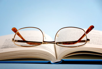 Pile of books over bright background like a concept for reading, readers, education, entertainment 