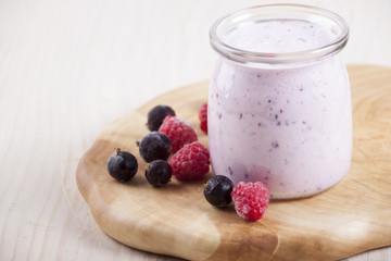 Smoothies with frozen berries  black currants and raspberries