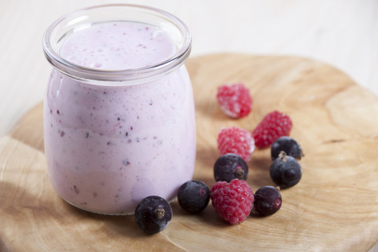 Smoothies with frozen berries  black currants and raspberries