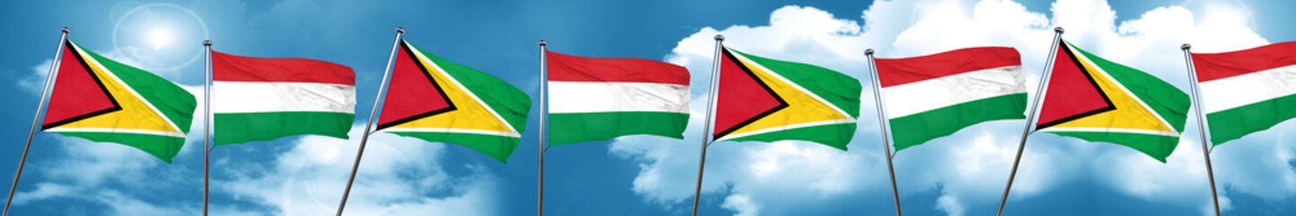 Guyana flag with Hungary flag, 3D rendering