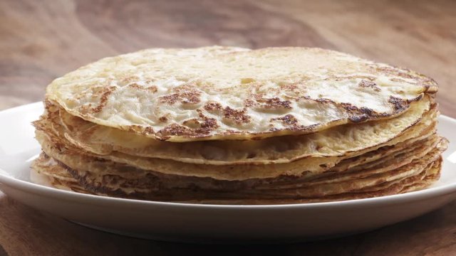 Slow motion of blin or crepe falling on stack, 180fps prores footage