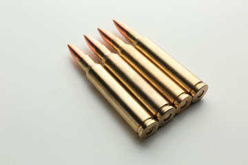 Rifle bullets on white background