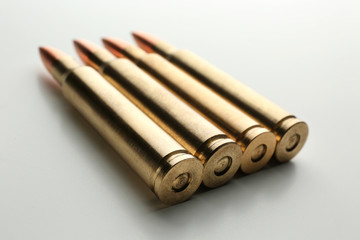 Rifle bullets on white background