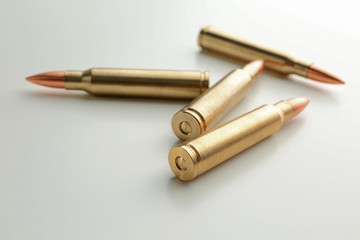 Rifle bullets on white background