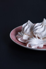 Heap of fluffy meringue on the plate