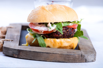 Vegetarian burger with cheese and vegetables