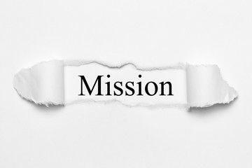 Mission on white torn paper