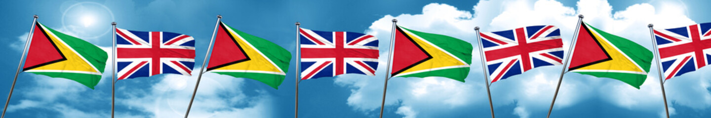 Fototapeta na wymiar Guyana flag with Great Britain flag, 3D rendering