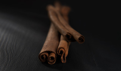 Cinnamon sticks on wooden table