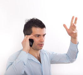 Stressed man talking on cell phone