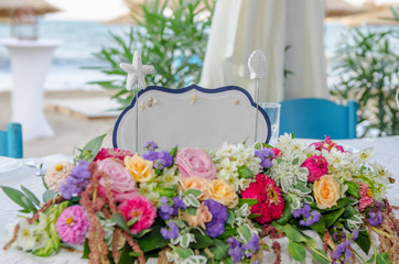 A white card Just married sign on table with flowers at a wedding