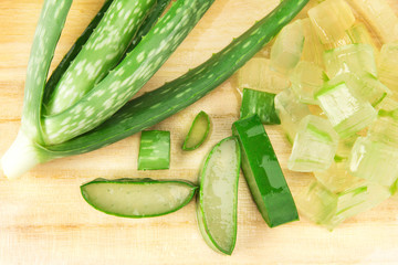 the sliced and leaf of fresh aloe vera on  wooden plate 