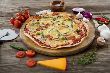Various species with pizza arranged on wooden tray