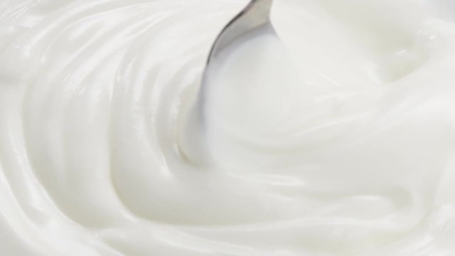 Slow motion of mixing yogurt with spoon, 180fps prores footage