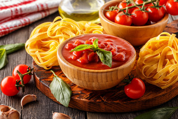 Products for cooking - tomato sauce, pasta, tomatoes, garlic, ol