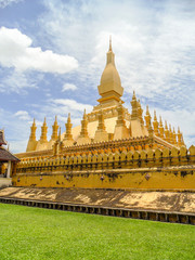 Naklejka premium That Luang is a gold-covered large Buddhist stupa in the center of Vientiane, Laos. 