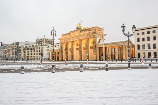 illuminated Brandenburg gate (Brandenburger Tor) and 18th of March Square in snow, Berlin, Germany, Europe