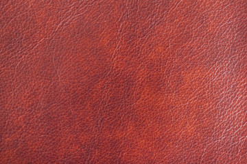 Texture of Genuine Leather shiny, antique, cracked, ,maroon color, background, surface.