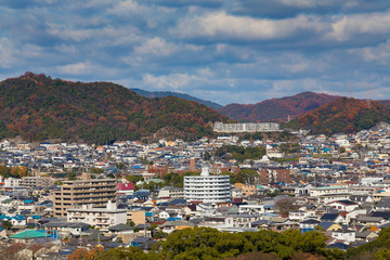 Fototapeta na wymiar Himeji residence downtown aerial view from Himeji castle in Hyogo, Kansai, Japan during autumn season