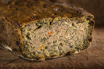 Romanian traditional food called Drob made from meatloaf on wood