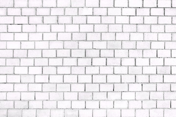 Old brick wall, the white surface of the stone blocks