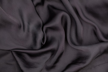 Black silk material. Texture. Background. For your design.