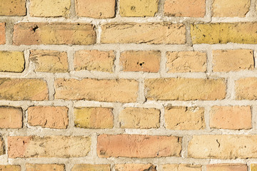 close up of orange brick wall texture background, vintage filtered style