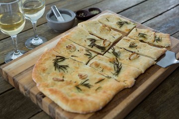 Slices of pizza served in a chopping board