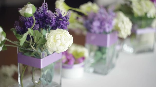 tableware and decor of bouquets of flowers for the wedding party