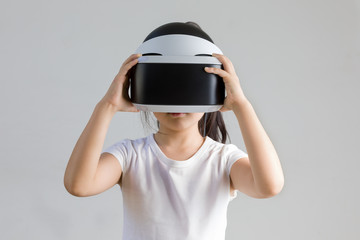Kid with Virtual Reality, VR, Headset Studio Shot Isolated on White Background. Child Exploring Digital Virtual World with VR Goggles.