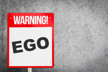 Red Warning EGO signage on cement copy space