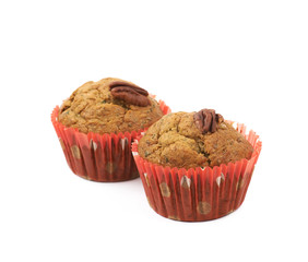 Two pecan nut muffins isolated