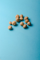 Walnuts, walnuts close-up, walnuts on blue background,