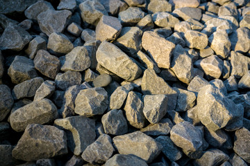 Crushed stone or angular rock is a form of construction aggregate, typically produced by mining a suitable rock deposit and breaking the removed rock down to the desired size using crushers.
