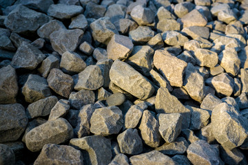 Crushed stone or angular rock is a form of construction aggregate, typically produced by mining a suitable rock deposit and breaking the removed rock down to the desired size using crushers.