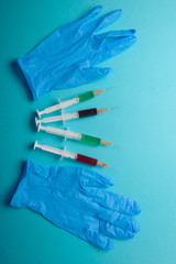 syringe on blue background.