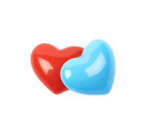 Two glossy heart shaped beads isolated