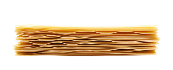 Pile of dried lasagna sheets isolated