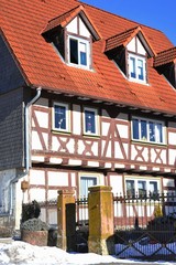 Renovated Half-Timber House-Front with Dormer Windows (Gauben) at tiled Roof (Ziegeldach)