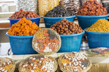 The stall with dried fruits at the Siab Dekhkhan Bazaar offers different raisins, apricots, prums and figs in Samarkand, Uzbekistan