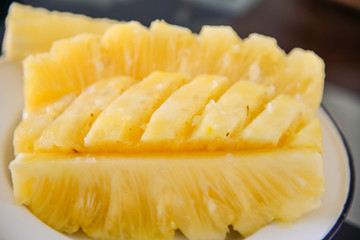 Close-up flesh of a pineapple slice.