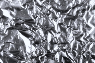 crumpled silver aluminum foil background, abstract texture