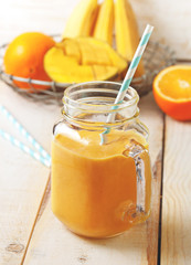 smoothie of banana, orange, mango