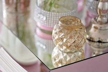 Fototapeta na wymiar Beautiful vintage glass candlestick on a table