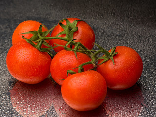 Fresh tomatoes in drops of water