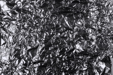 crumpled silver aluminum foil background, abstract texture