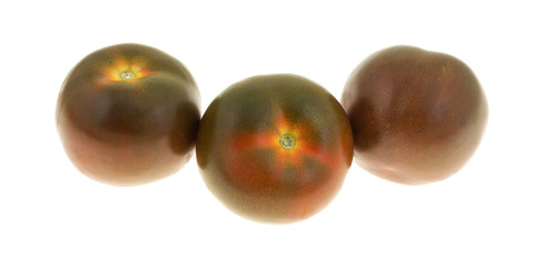 Three brown tomatoes isolated on a white background