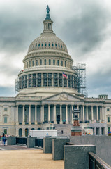 Obraz premium WASHINGTON DC, USA The United States Capitol view from the street. In 2014, scaffolding was erected around the dome for a restoration project scheduled to be completed by 2017. 