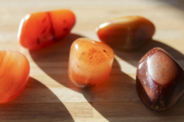 Orange and brown stone on board
